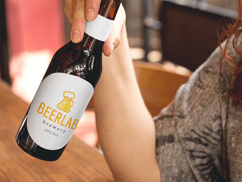 Label Mockup Of A Woman Having A Beer At A Bar A6856